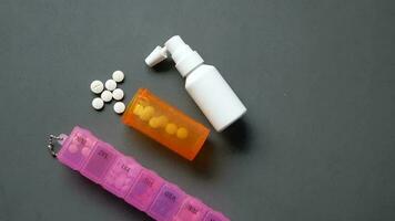 medical pills , pill box and spray on table video