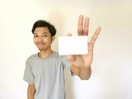 man showing close up empty card to focus on the card. photo