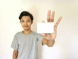 man showing close up empty card to focus on the card. photo