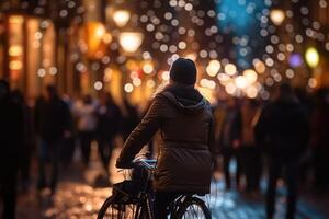 Photo of a person riding a bike in the city crowd under the lights at night in the city, and among the crowds of people. .