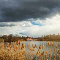 May storm at the ancient Maltese castle. Spring sunny landscape in the ancient Russian city of Gatchina. Russia photo