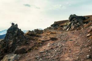 Mountain off-road track to high mountain village in Caucasus region. photo