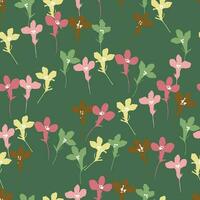 seamless mixed colourful tiny flowers pattern on green  background for fashion fabric vector