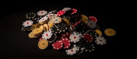 Casino chips on the black background with casino cards. photo