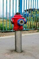 Old hydrant on the street photo