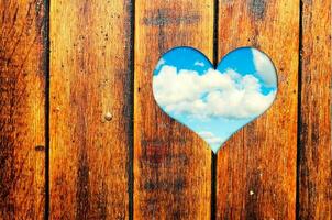 Heart shape carved on hood with sky view photo