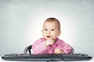 Baby on a computer photo