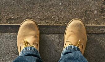 Yellow boots on the road photo