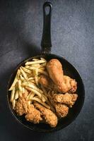 Fried chicken with french fries photo