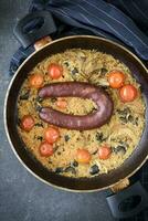 Spicy sausage dish photo