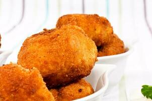 Fried potatoes croquets photo