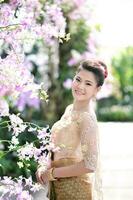 Beautiful Thai girl in Thai traditional costume photo