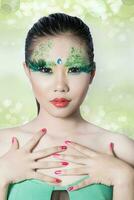 beautiful women with perfect art make up and long false eyelashes made from feathers photo