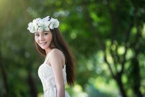 pretty Asian girl with birds crown photo