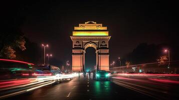 India gate at night with multicolored lights. This landmark is one of the main attractions of Delhi and a popular tourist destination. photo