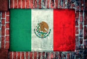 Mexican flag on brick wall photo