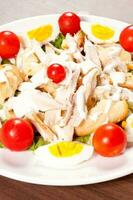 Caesar salad with dressings photo