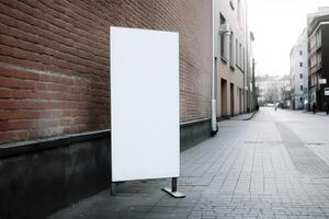 A blank white billboard mockup on a sidewalk in a city photo