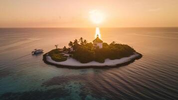Aerial view of a lighthouse of a luxury resort with bungalows on a small island at sunset, Laccadive Sea, Indian Ocean, photo