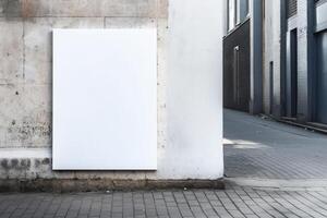 A blank white billboard mockup on a sidewalk in a city photo