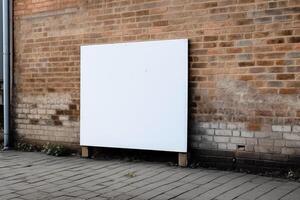 A blank white billboard mockup on a sidewalk in a city photo