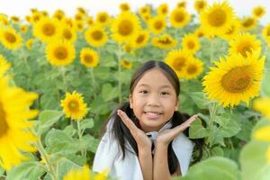 Happy cute asian girl smile with sunflower, photo