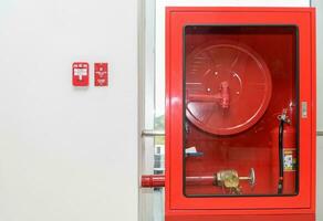 Fire extinguisher and fire hose reel photo