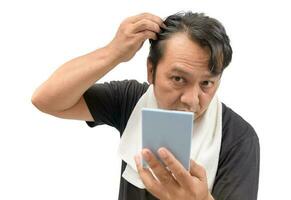man worry about his  hair loss or alopecia photo