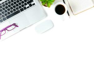 White office desk table with laptop computer, photo