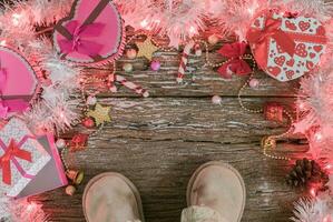 Christmas background, light and gift box with child boots photo