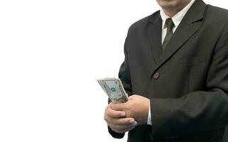 Businessman holding Money Cash Dollars in hands isolated photo