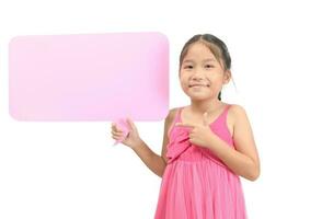 Portrait of cute asian girl holding empty pink speech bubble. photo