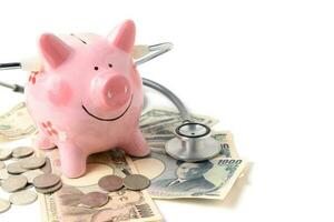 piggy bank with Stethoscope  isolated photo