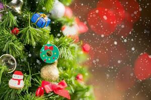 Chrismas tree with gift and snow on old wood photo