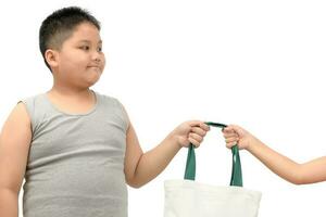 fat boy holding canvas tote bag with sister photo