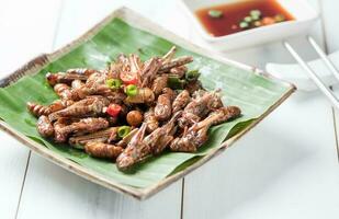Fried grasshoppers and fried wormer fried silkworms photo