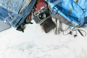 prepare backpack accessories and travel items photo