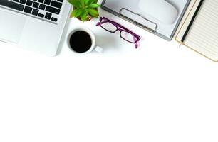 White office desk table with laptop computer, photo