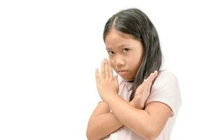 Serious cute girl showing crossed hands or forbidding gesture photo