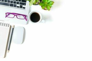 White office desk table with laptop computer, photo