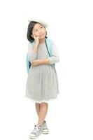 cute asian little girl stand thinking isolated photo