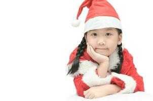 cute little asian girl in red santa hat isolated photo