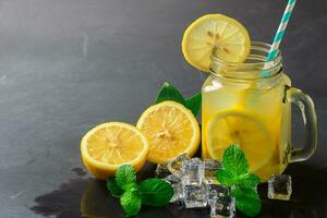 lemons juice and fresh slice lemon with peppermint photo