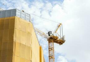 Tower construction crane in construction site building photo