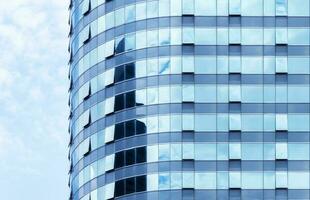 Modern office tower building with blue sky background photo