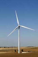 Wind turbines in a field photo