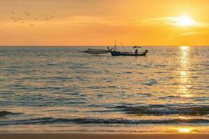 Sunset in Khao Lak at beach and clouds photo