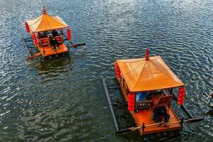 Chinese boats on the lake at Ban Rak Thai, northern Thailand photo