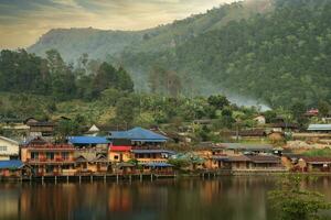 Smooth glassy lake at Ban Rak Thai photo