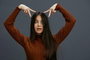 beautiful woman hand gestures brown sweater fashion Lifestyle photo